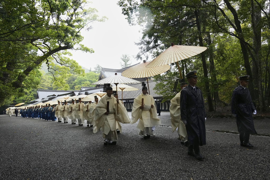 Priests and officials in the Shinto priesthood march during Yamaguchisai, a kickoff ceremony of the Shikinen Sengu ritual, which concludes in 2033 (AP